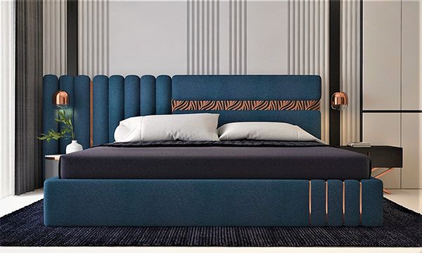 a bed with blue headboard and white pillows in a modern style bedroom, along with black rugs