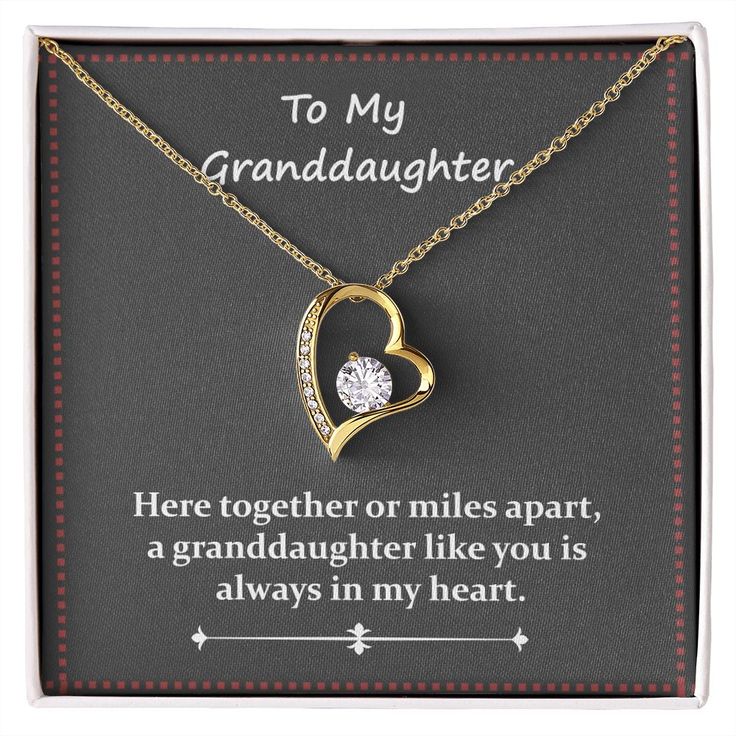 To My GranddaughterHere together or miles apart, a granddaughter like you is always in my heart.The dazzling Forever Love Necklace is sure to make her heart melt! This necklace features a stunning 6.5mm CZ crystal surrounded by a polished heart pendant embellished with smaller crystals to add extra sparkle and shine. Beautifully crafted with either a white gold or yellow gold finish, be sure to give her a classic gift she can enjoy everyday. 14k white gold finish or 18k yellow gold finish 6.5mm Meaningful Jewelry Gift For Mom On Valentine's Day, Open Heart Necklace With Hallmark For Anniversary, Meaningful Hallmarked Jewelry For Valentine's Day, Meaningful Yellow Gold Jewelry For Anniversary, Certified Open Heart Anniversary Necklace, Meaningful Hallmark Jewelry For Valentine's Day, Meaningful Jewelry For Anniversary And Valentine's Day, Open Heart Jewelry For Birthday And Mother's Day, Meaningful Jewelry For Anniversary On Valentine's Day