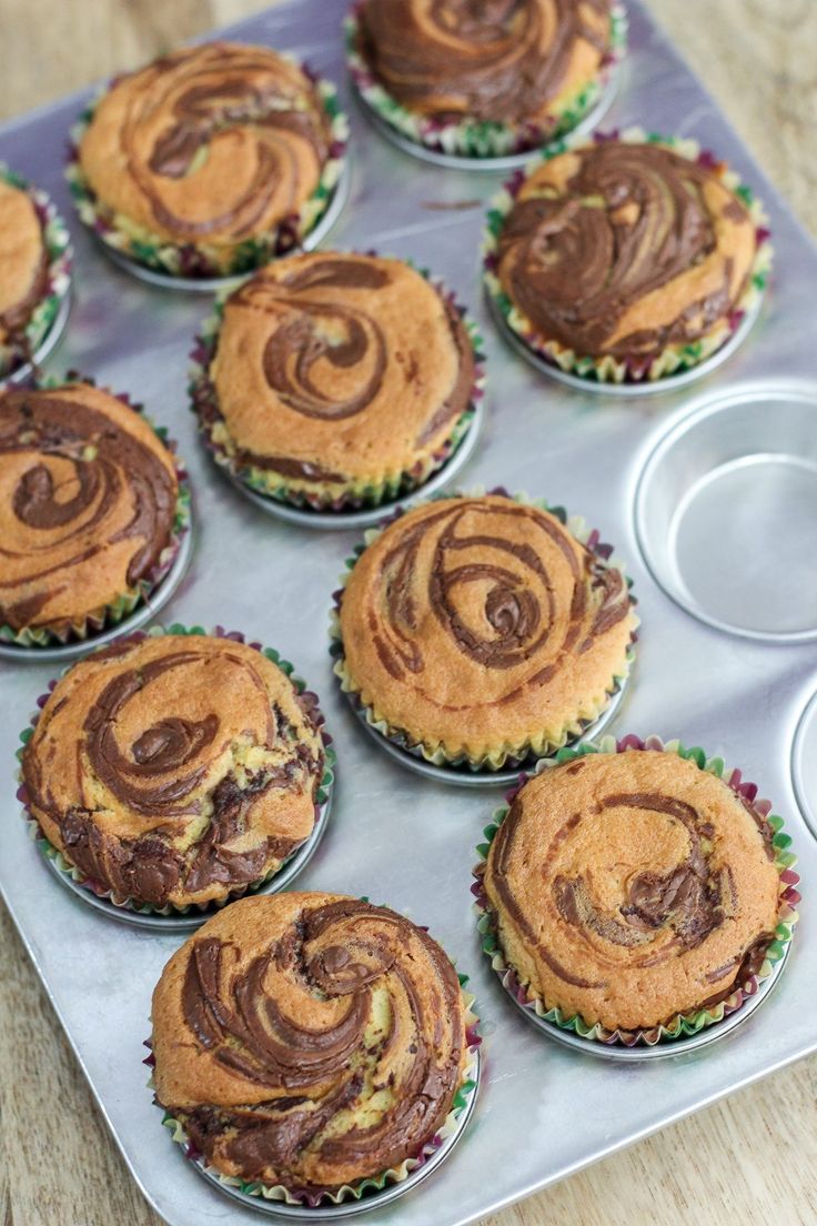 there are many cupcakes on the table ready to be eaten