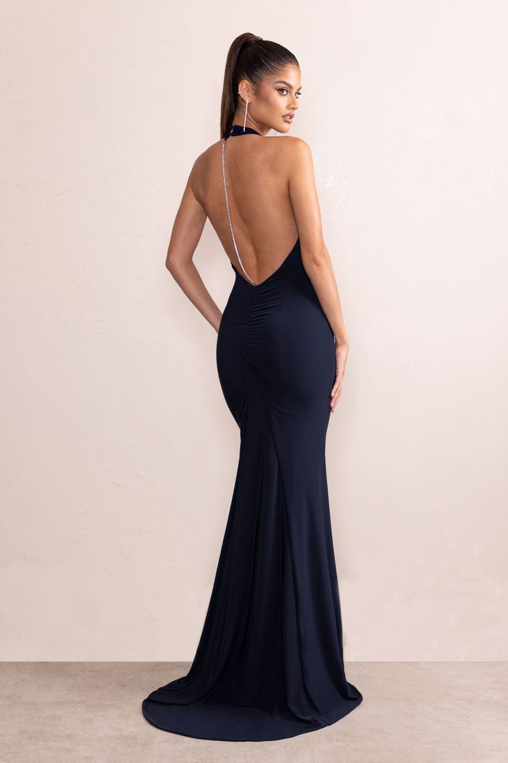 Make a statement in Dania. our dark navy maxi dress. Featuring a plunge halter neck and thigh-high split. Dania oozes understated sophistication whilst the low back detailing adds a playful touch. The ultimate event dress. Dania is sure to turn heads and let you step out in confidence. The beautiful feminine silhouette promises to flatter your figure for an effortlessly chic look that is guaranteed to turn heads.Features Cascading hemline Halter neck Plunge neckline Front split Luxe jersey fabri Backless Maxi Dress With Keyhole Back For Night Out, Backless Maxi Dress With Side Slits For Gala, Gala Backless Dress With Side Slits, Backless Evening Maxi Dress, Halter Neck Evening Dress With Keyhole Back, Backless Dress With Side Slits For Gala, Halter Neck Maxi Dress With Keyhole Back For Evening, Glamorous Backless Maxi Dress With Side Slits, Formal Backless Maxi Dress With Keyhole Back