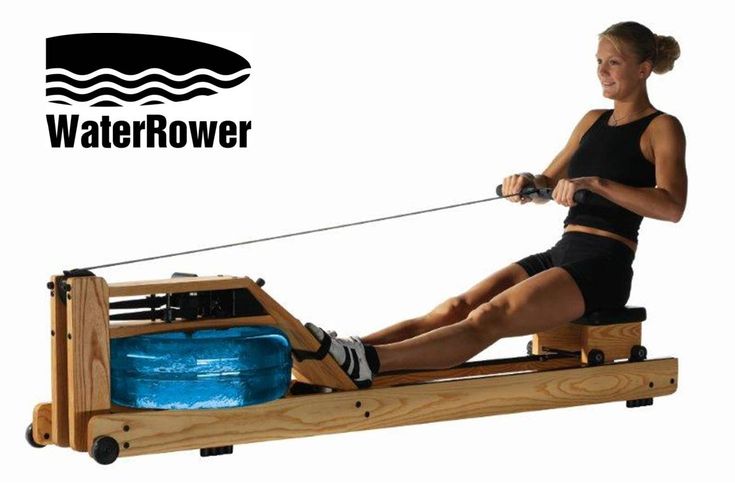 a woman is using a rowing machine to do exercises on the water skis,