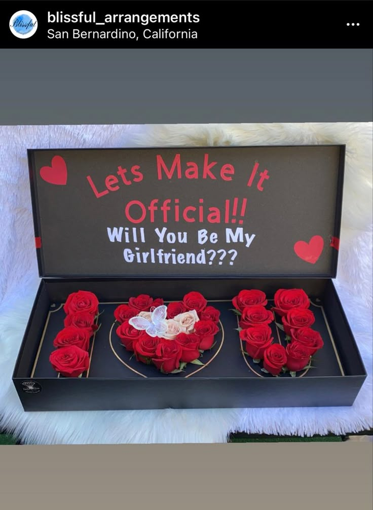 an open box with roses in it and the words let's make it official will you be my girlfriend?