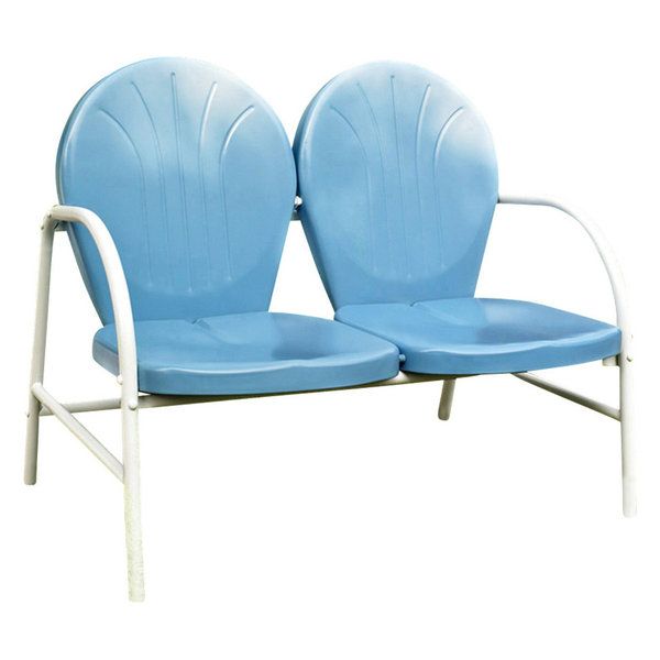 two blue chairs sitting next to each other