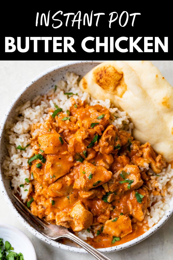 a white bowl filled with chicken and rice next to a side of gravy