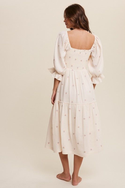 - Ditzy floral embroidery puff sleeve maxi dress- Floral embroidered crinkle textured fabrication - Square neck- Smocking on top- Mid length puff sleeve with elastic ruffle cuffs- Hidden side seam pockets- Finished with clean hem- Lined- Model is 5' 11" 32-24-34 and wearing a size Small Made In: IMPORT Fabric Contents: Self: 100% CottonLining: 100% Polyester Size Measurement (inch): S: 14.3 (Bust), - (Waist), - (Hips), 48.0 (Length) M: 14.8 (Bust), - (Waist), - (Hips), 48.5 (Length) L: 15.3 (Bus Elegant Spring Smocked Dress With Square Neck, Elegant Square Neck Smocked Dress For Spring, Feminine Beige Midi Dress With Floral Embroidery, Feminine Midi Length Embroidered Dress With Floral Details, Feminine Midi-length Embroidered Dress With Floral Embroidery, Feminine Dress With Smocked Back And Straight Neckline, Feminine Smocked Dress With Square Neck For Garden Party, Feminine Square Neck Smocked Dress For Garden Party, Spring Embroidered Dress With Straight Neckline