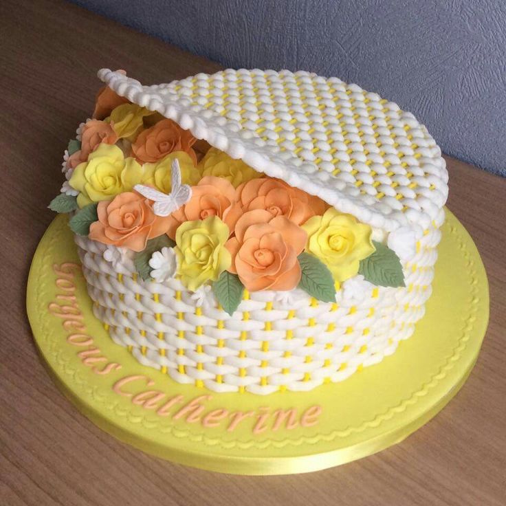 there is a cake that has flowers on the top and bottom, sitting on a yellow plate