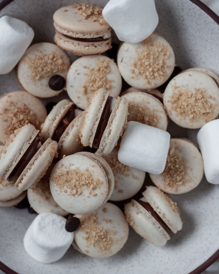 a bowl filled with marshmallows and cookies