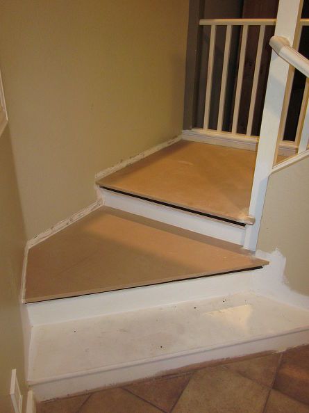 the stairs are being painted white and brown