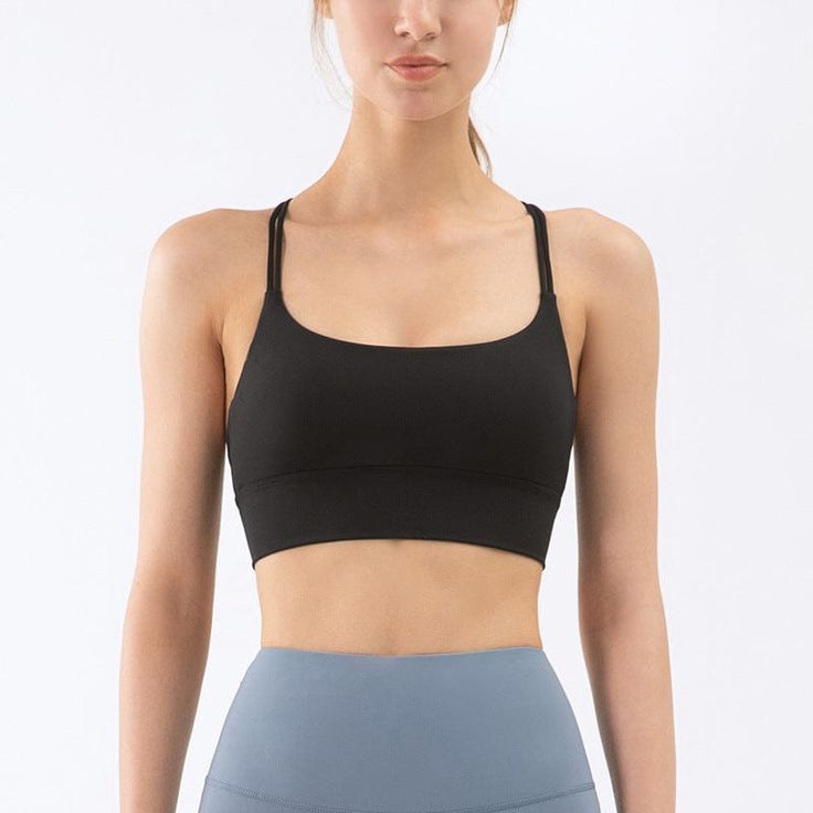 The EMES SHOP bra is detailed with a scoop neckline. Features a doublethin straps. and crosses over in the back. This buttery soft. light-weight. breathable sports bra tank is perfect for your next yoga class. morning run. afternoon hike. or trip to the gym.MATERIAL:73% Nylon 27% SpandexMEASUREMENTS:Small : 4-6 Waist: 25-26.5 in Chest: 33-34.5 inMedium : 6-8 Waist: 26.5-28 in Chest: 34.5-36 inLarge : 8-10 Waist: 28-29.5 in Chest: 36-37.5 inX-Large : 10-12 Waist: 29.5-31 in Chest: 37.5-39 in Seamless Cross Back Activewear For Pilates, Seamless Cross-back Activewear For Pilates, Athleisure Strappy Sports Bra With Built-in Bra, Yoga Activewear With Adjustable Straps And High Stretch, Versatile Activewear With Built-in Bra And Cross Back, Strappy Sports Bra For Yoga, Compression Yoga Activewear With Straps, Compression Activewear With Straps For Yoga, Activewear With Built-in Bra And Medium Support