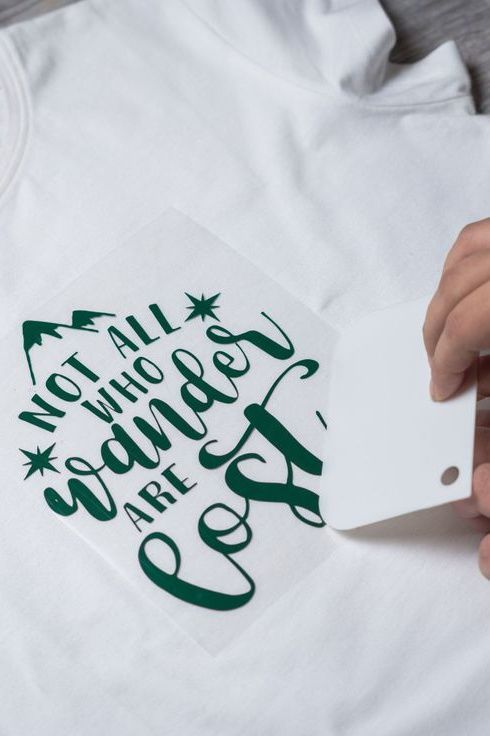 someone is cutting out a t - shirt that says not all who wander are lost