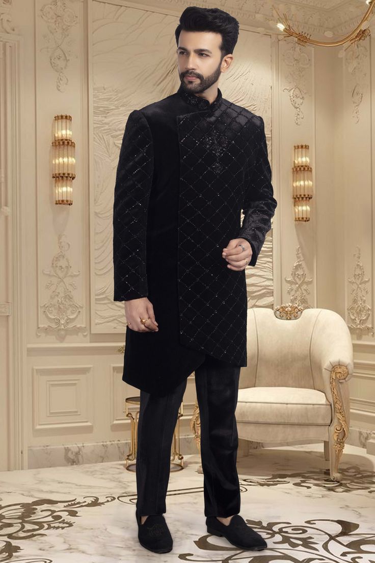 This black sherwani is adorned with delicate cutdana and shimmering sequins, making it an exquisite choice for sangeet ceremonies or reception nights. The perfect choice for any wedding, this sophisticated piece will have you looking and feeling your best. Bollywood Style Wedding Sherwani For Winter, Bollywood Style Sherwani For Wedding In Winter, Bollywood Style Sherwani For Winter Weddings, Winter Wedding Bollywood Bandhgala, Bollywood Style Bandhgala For Winter Wedding, Elegant Sherwani With Dupatta For Reception, Elegant Bandhgala With Dupatta For Reception, Formal Black Kurta With Dabka Work, Elegant Nehru Jacket With Dupatta For Reception