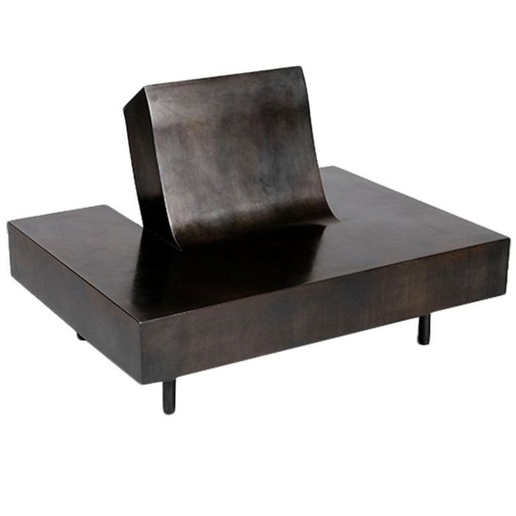 a wooden table with a square shaped object sitting on it's top and legs