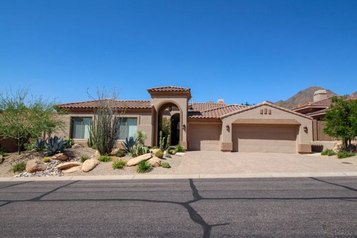 a large house in the middle of a desert