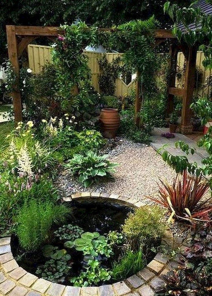 an outdoor garden with lots of plants and water