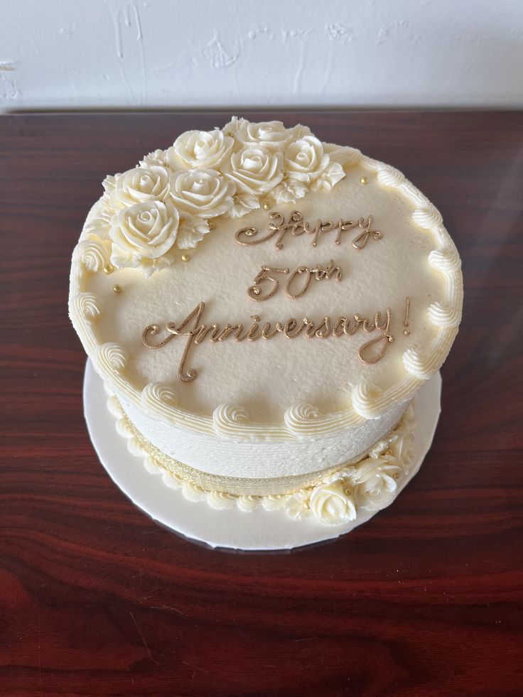 a white cake sitting on top of a wooden table