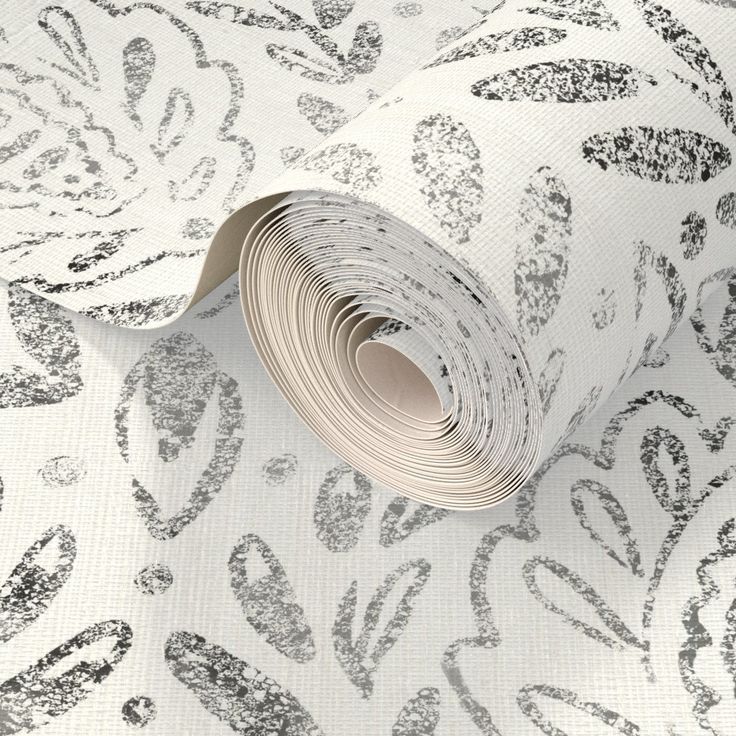 a white and silver wallpaper with an intricate design on it's surface,