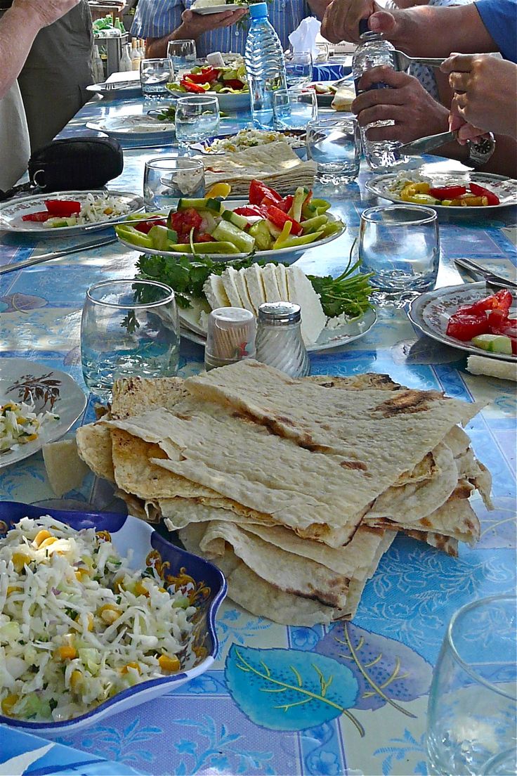 a long table with plates of food on it