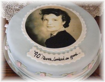 a cake with an image of a young woman on it's side and the words, 90 never looked as good