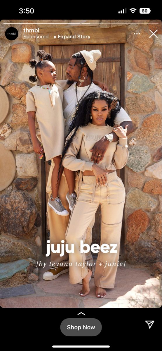 the website for juju beez is displayed with two women and one man standing in front of a stone wall