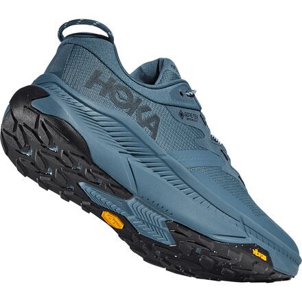 Technical features, performance, and a casual style, the HOKA Transport GTX Shoe has it all and is at home on the trail or the city sidewalk. Featuring a Cordura mesh upper combined with GORE-TEX Invisible Fit, the Transport GTX Shoe is super durable, abrasion-resistant, and waterproof, so we are ready for our next adventure, no matter what it holds. Nearly every part of this shoe is made from recycled or organic materials for an eco-conscious build. The Vibram EcoStep Recycled EVO outsole Functional Blue Trail Running Shoes For Streetwear, Blue Trail Running Shoes For Streetwear, Dynamic Trail Running Shoes With Moisture-wicking For Outdoor Activities, Sporty Gore-tex Trail Running Shoes, Gore-tex Trail Running Shoes With Boost Midsole For Streetwear, Dynamic Moisture-wicking Running Shoes For Outdoor, Urban Mesh Running Shoes For Outdoor, Technical Trail Running Shoes With Moisture-wicking, Functional Gore-tex Running Shoes For Streetwear