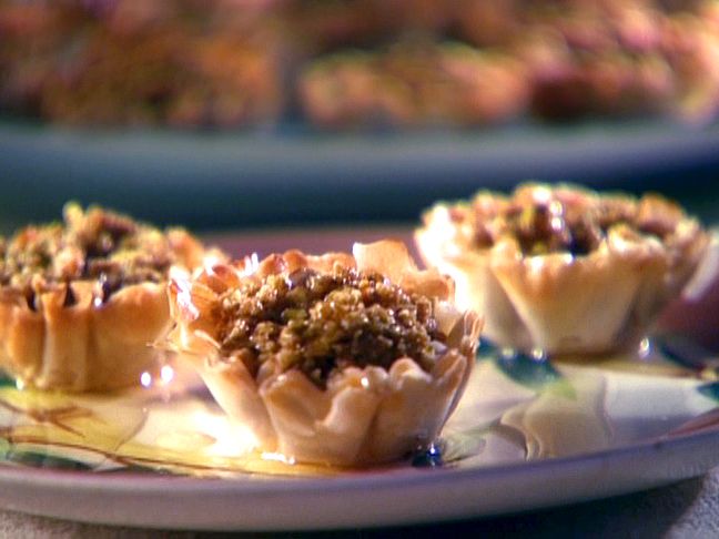 small desserts are sitting on a plate ready to be eaten