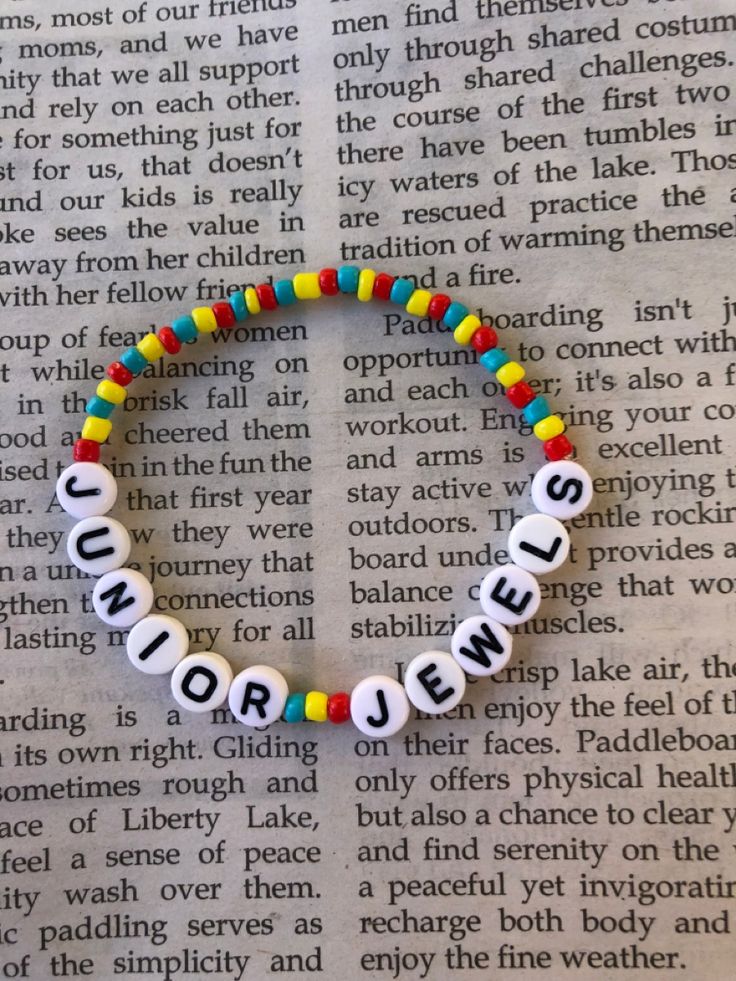 a beaded bracelet with words that spell out the word's name on it