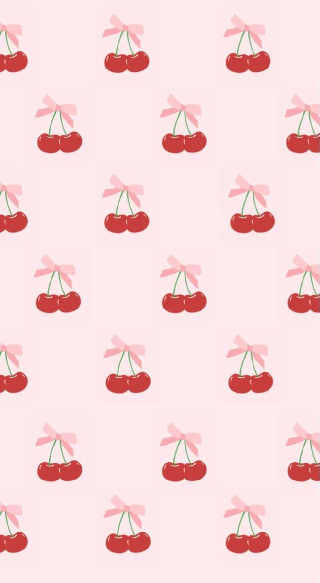 a pink wallpaper with cherries on it