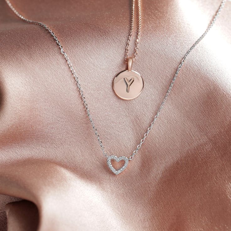 Our open heart pendant is a timeless expression of love. It’s the sweetest gift for yourself or for someone you hold close to show them just how much you care for them. With sparkling cubic zirconia and a dainty chain, this piece is perfectly flirty and feminine. 14KT yellow, rose or white gold plated AAAAA Cubic Zirconia Measurements: Diameter: 8mm (.3”) Chain length: 18”+2” extender Dainty Pendant Necklace, Dainty Choker Necklace, Silver Dragon Necklace, Heart Choker Necklace, Dainty Necklaces, Open Heart Necklace, Dainty Choker, Simple Addition, Heart Choker