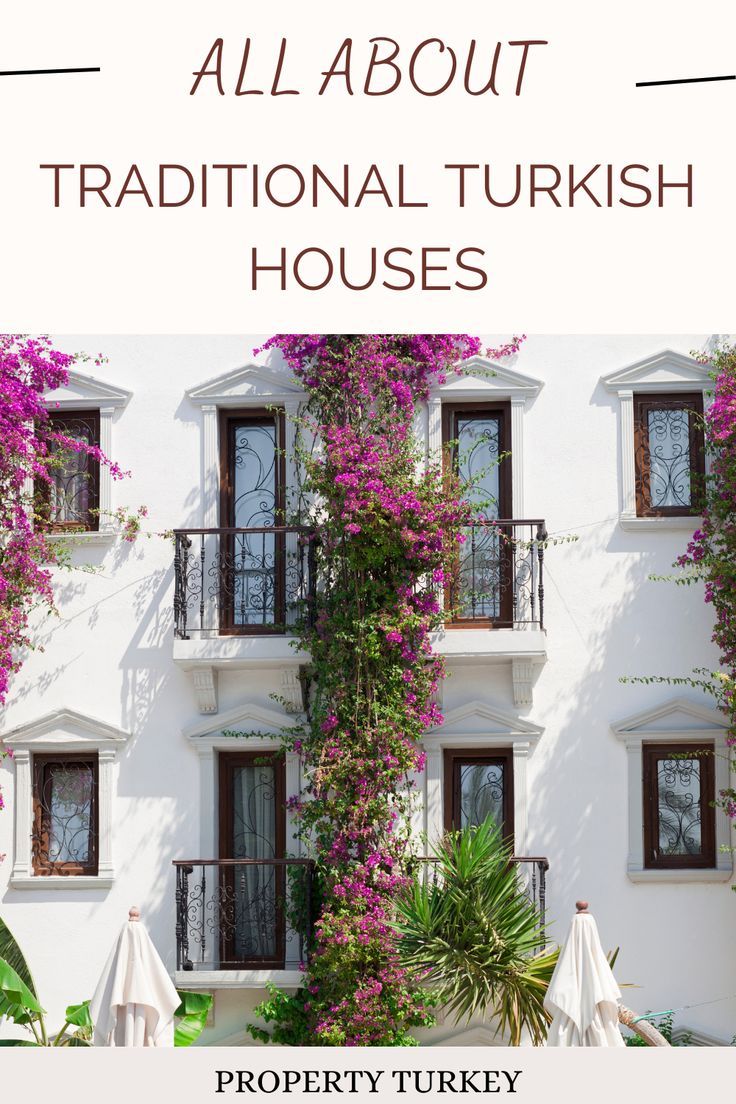 a white house with purple flowers growing on it and the words, all about traditional turkish houses