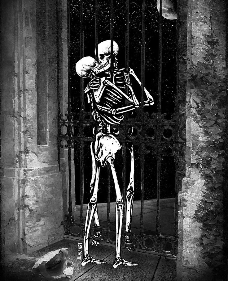 a skeleton standing in front of an iron gate holding a basketball ball up to its face