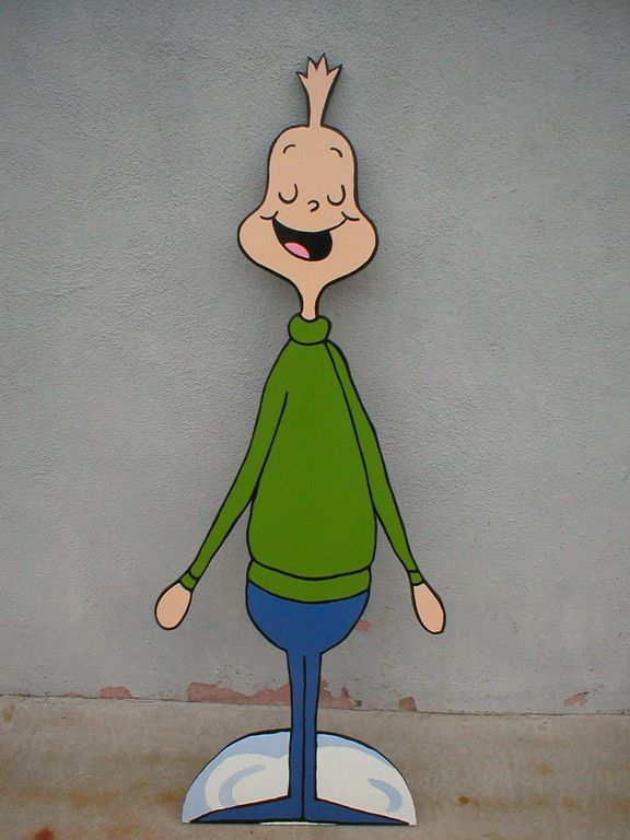 a cartoon character standing on top of a surfboard in front of a gray wall