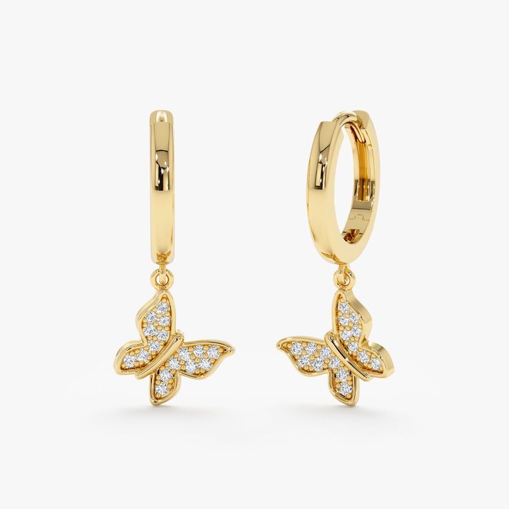 Soar up high with the beauty and grace of a butterfly. Add a touch of captivating sparkle to your everyday look with these 14k solid gold huggie earrings. Dainty butterfly charms, meticulously set with pavé natural diamonds, shimmer and shine, creating a playfully luxurious statement. Available in timeless 14k yellow, elegant white, or romantic rose gold. - Handmade Gold - Solid Gold - Natural Diamonds  - G Color, SI Quality Diamonds - Dimension of Butterfly: 7 mm - Total Diamond Carat Weight: 0 Hoop Huggie Earrings, Gold Butterfly Earrings Fine Jewelry, Butterfly-shaped Yellow Gold Earrings For Anniversary, Yellow Gold Butterfly Earrings For Anniversary, Butterfly-shaped Yellow Gold Anniversary Earrings, Gold Butterfly Fine Jewelry Earrings, Gold Hoop Earrings With Butterfly Charm, Gold Earrings With Butterfly Charm For Anniversary, Elegant Gold Butterfly Hoop Earrings