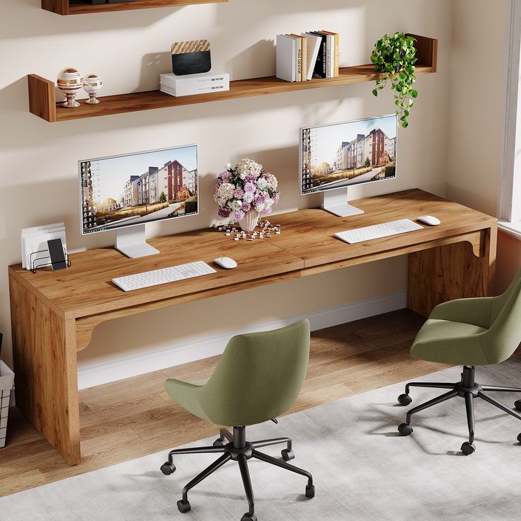 a desk with two computer monitors on it and some chairs in front of the desk