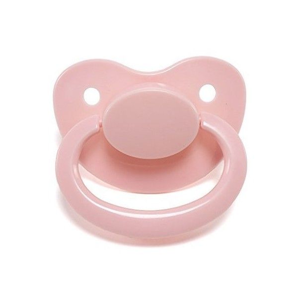 a pink pacifier sitting on top of a white surface