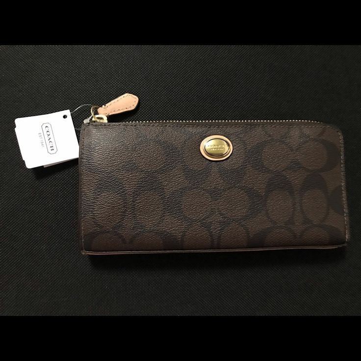 New Never Used Coach Brown/Tan Wallet. Gold Hardware.One Large Zip Pocket And Multi Card Slots On The Inside Of The Wallet. In Great Condition. Classic Brown Wallet With Removable Pouch, Brown Wallet For Everyday Use, Coach Brown Wallet With Card Slots, Coach Wallet With Snap Closure For Everyday Use, Elegant Brown Wallet For Daily Use, Coach Brown Wallet With Coin Pocket, Brown Coach Wallet With Coin Pocket, Coach Brown Rectangular Wallet, Brown Bifold Wallet With Removable Pouch