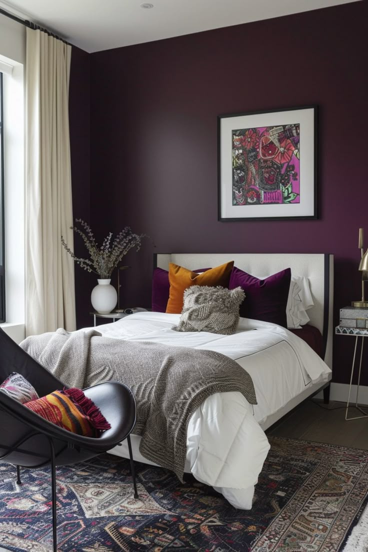 a bedroom with purple walls, white bedding and an area rug on the floor