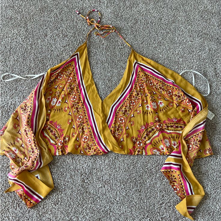 Super Cute Halter Top Ties In The Back Similar To A Scarf Top Size Small Never Worn Nwot Yellow V-neck Top For Beach Season, Yellow V-neck Crop Top For Beach, Yellow Triangle Halter Top For Spring, Yellow Triangle Top For Spring, Spring Yellow Triangle Halter Top, Yellow Triangle Halter Top For Summer, Yellow Triangle Halter Top For Vacation, Yellow V-neck Crop Top For Day Out, Yellow Halter Top For Spring Vacation