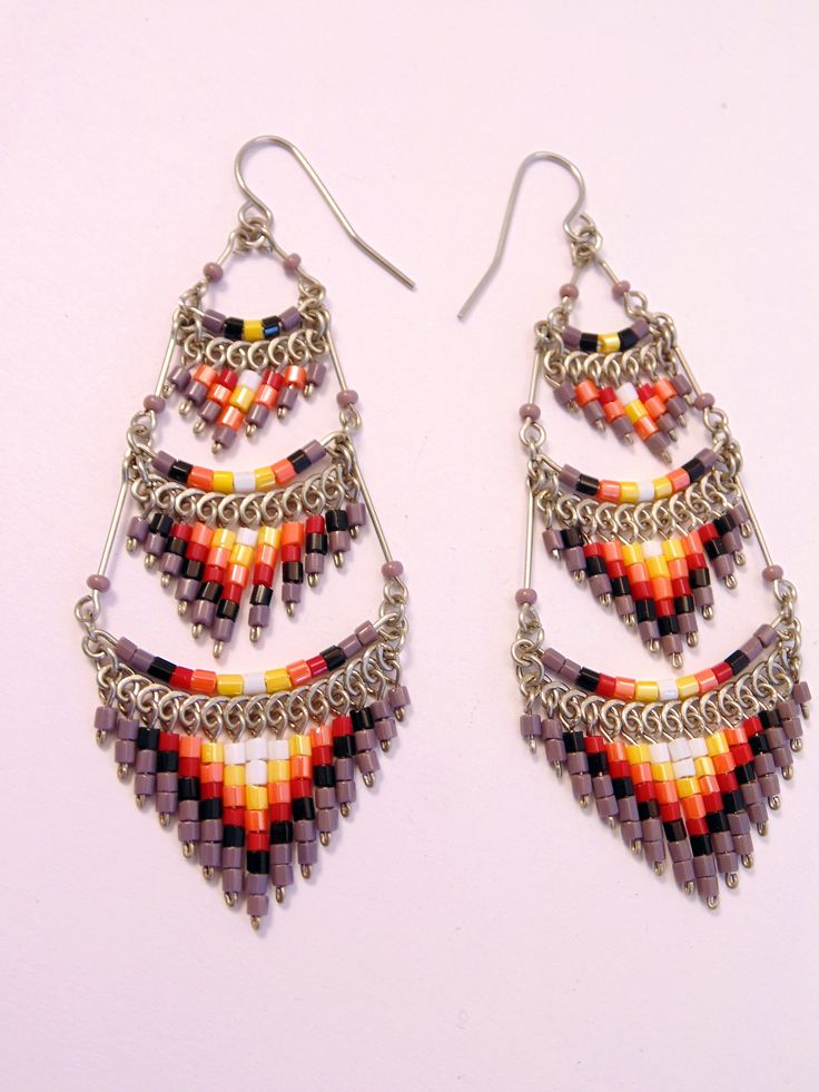 These gorgeous earrings were hand beaded in Peru. They measure 3 inches in length, 1 inch in width, with surgical steel ear wires. Festival Jewelry With Round Beads And Ear Wire, Traditional Long Drop Beaded Earrings With Dangling Beads, Traditional Long Drop Beaded Earrings, Traditional Teardrop Chandelier Earrings With Dangling Beads, Festival Chandelier Drop Earrings With Dangling Beads, Traditional Long Drop Jewelry With Dangling Beads, Festival Dangle Beaded Earrings For Pierced Ears, Festival Beaded Dangle Earrings, Traditional Long Drop Earrings With Dangling Beads