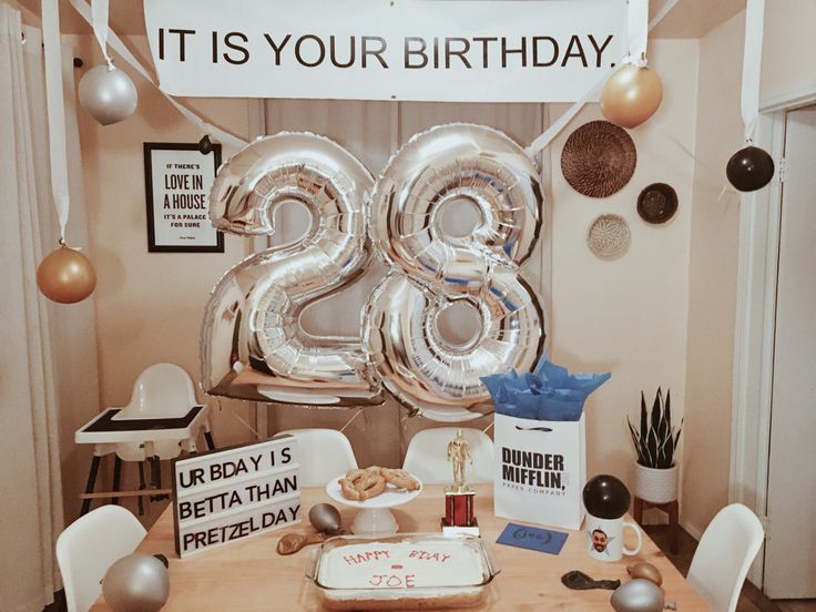 an image of a birthday party with balloons and presents on the table for someone's 30th birthday