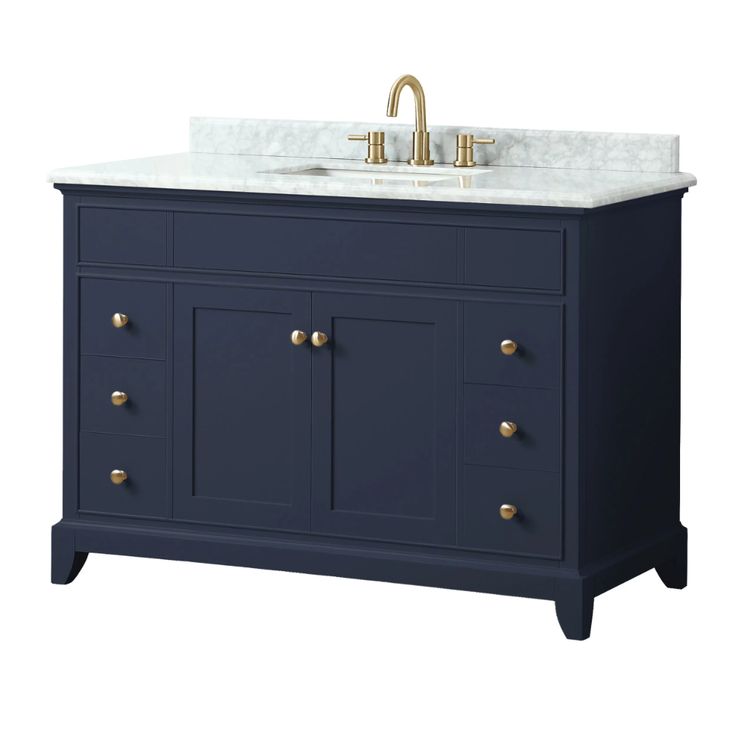 a bathroom vanity with marble top and two brass faucets on the sink area