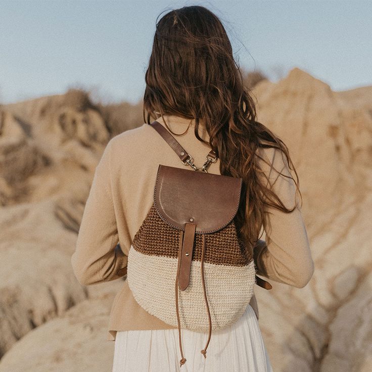 Ideal for any adventure and perfect for days spent on a plane or the beach, The Transito Backpack is a catch-all that’s up for everything you are. It has adjustable leather straps and a cinching leather top to secure your goods but still allow you convenient access. Handmade by skilled artisans and woven from an all-natural, plant-dyed cactus fiber and high-quality, vegetable-tanned leather. Style Notes Adjustable, removable straps Size: H 12" x L 9.5" x W 9" Large enough to hold all the essenti Adventure Backpack With Leather Trim, Casual Adventure Backpack Shoulder Bag, Standard Backpack With Adjustable Strap For Adventure, Everyday Bags With Adjustable Leather Trim, Adjustable Bags With Leather Trim For Everyday Use, Everyday Use Bags With Leather Trim And Adjustable Fit, Beige Travel Bag With Leather Strap, Adventure Leather Backpack With Leather Handles, Adventure Leather Backpack With Adjustable Strap