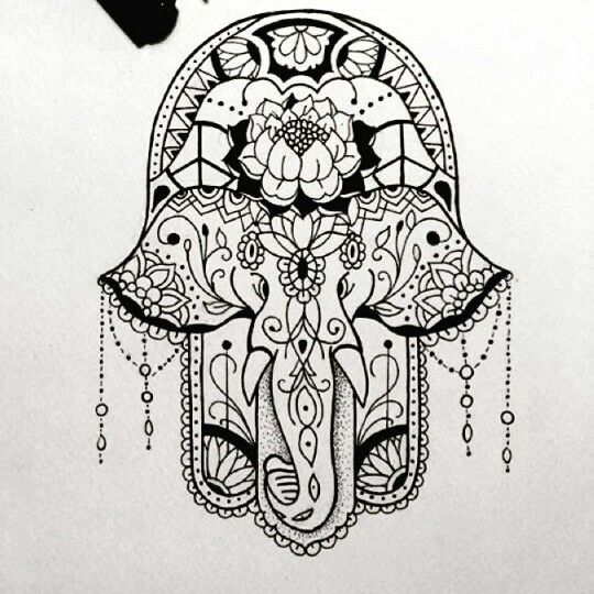 an elephant's head is drawn in black and white with intricate designs on it