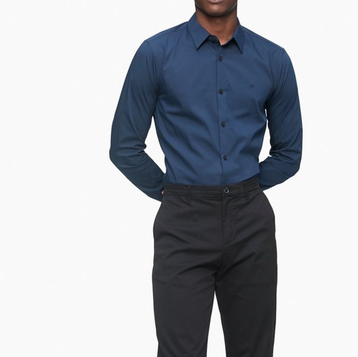 Calvin Klein Delf Blue Dress Shirt Slim Fit . Stretch Cotton Button-Down Shirt Versatile Solid Styling In A Diverse Array Of Seasonal Colors Provides Ultimate Comfort By Stretching As You Move Extra Soft Cotton Stretch Blend For A Smooth, Flexible Feel Point Collar And Button-Front Long Sleeves And Button Barrel Cuffs Embroidered Ck Logo And Shirttail Hem Machine Wash 76% Cotton 21% Polyamide 3% Elastane Size 16_16.5 Large Size Calvin Klein Button-up Tops For Business Casual, Blue Slim Fit Dress Shirt With Buttons, Slim Fit Blue Dress Shirt With Button Closure, Navy Formal Shirt With Buttons, Formal Navy Shirt, Navy Fitted Dress Shirt For Work, Casual Navy Dress Shirt For Work, Navy Formal Shirt For Spring, Blue Workwear Shirt With Button Cuffs