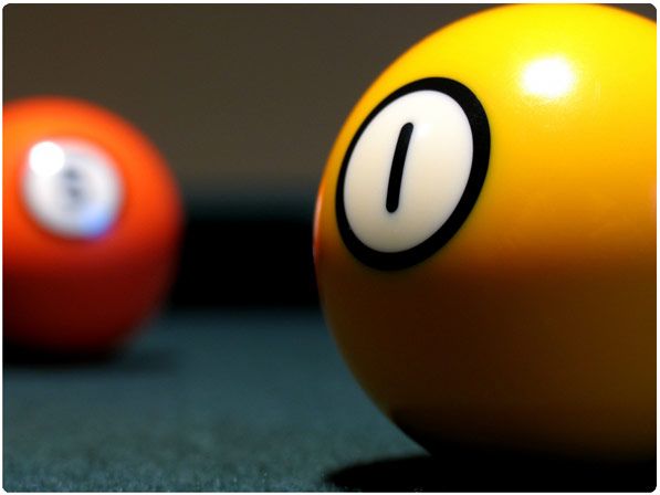 two billiard balls with the number one on them are sitting next to each other