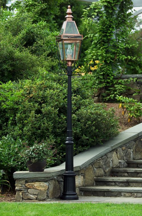 a lamp post in front of some steps