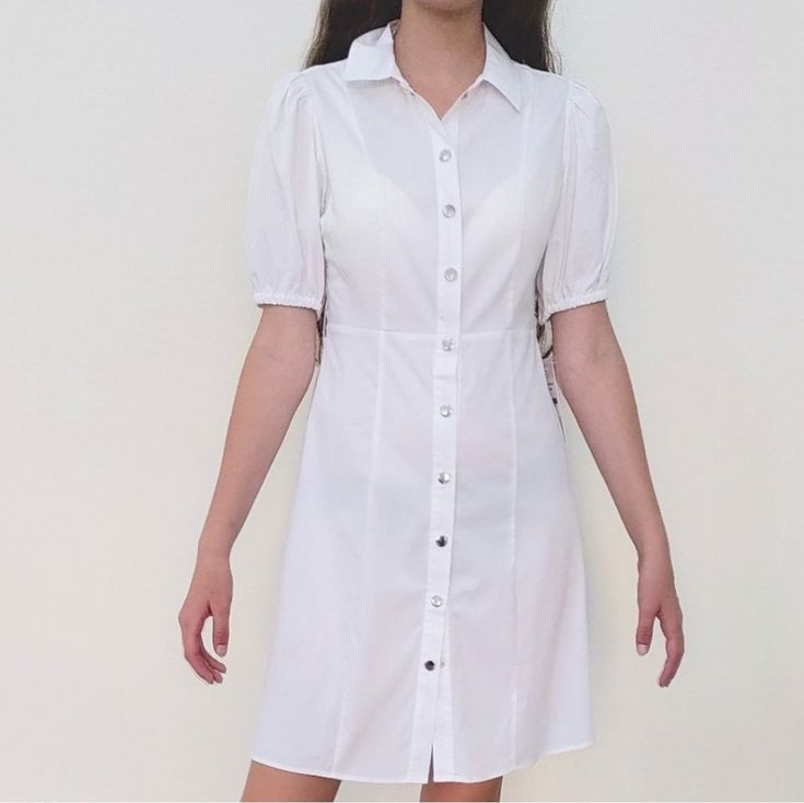 White Shirt Mini Dress Brand: Nanette Lepore Size:2 Color: White Silver Snap Buttons Down Closure Shirtdress Style Tide Waist Strap Lining Dress (Inside) Elastic Short Sleeves With New With Tags !Please See All Pictures For Details About Style And Measurements! White Elegant Slim Fit Mini Dress, Elegant White Slim Fit Mini Dress, Feminine Fitted Collared Mini Dress, Solid Fitted Mini Length Shirt Dress, Solid Fitted Mini Shirt Dress, Feminine Fitted Mini Dress With Collar, Fitted Solid Mini Shirt Dress, Fitted Solid Color Mini Shirt Dress, Summer White Collared Dress