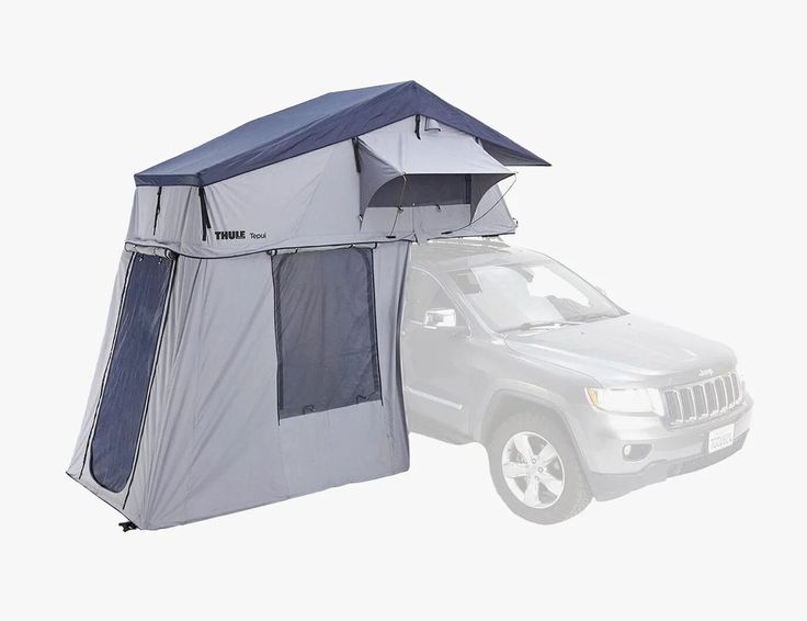 an suv with a tent attached to it