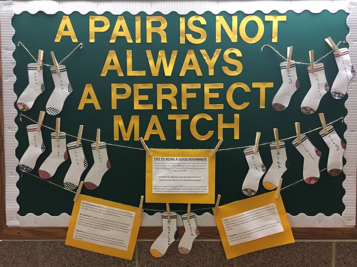 a bulletin board with socks hanging on clothes pins