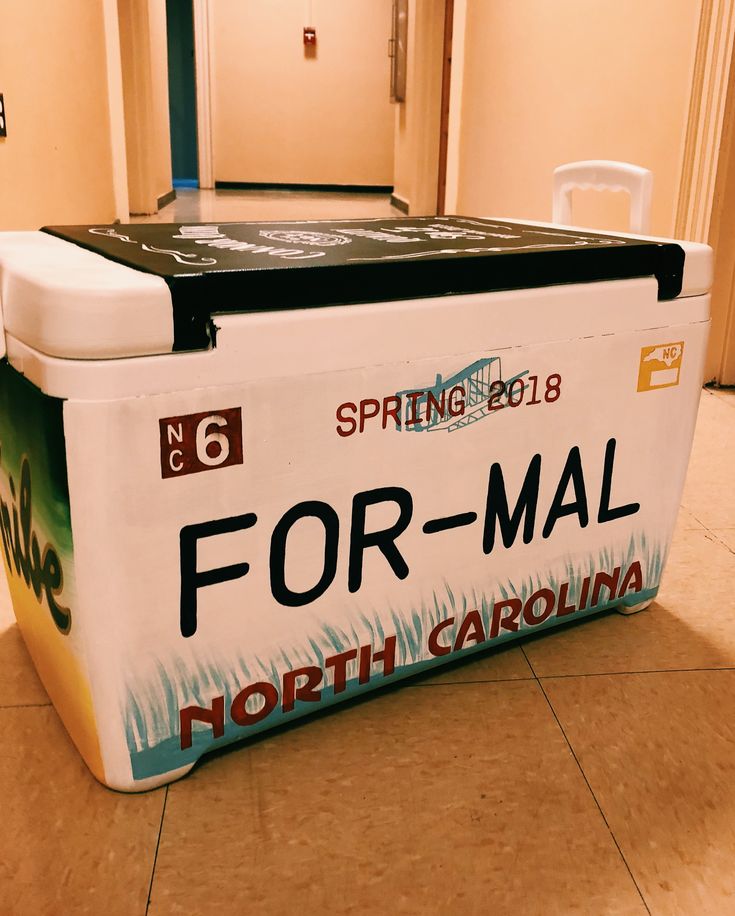 a large ice chest sitting on top of a tile floor next to a doorway with the words for - mall north carolina written on it