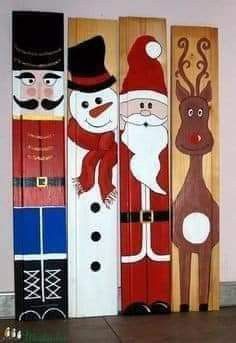 three snowmen, santa clause and reindeer painted on wooden boards